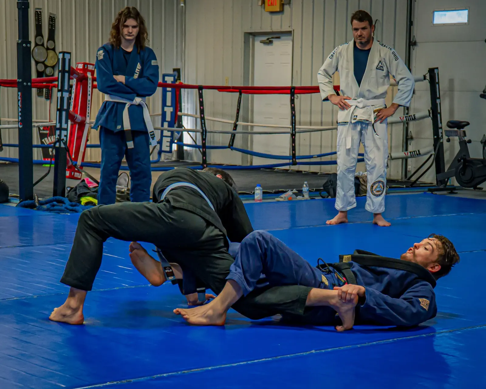 Training at Delta Grappling Academy with the boxing ring along the wall