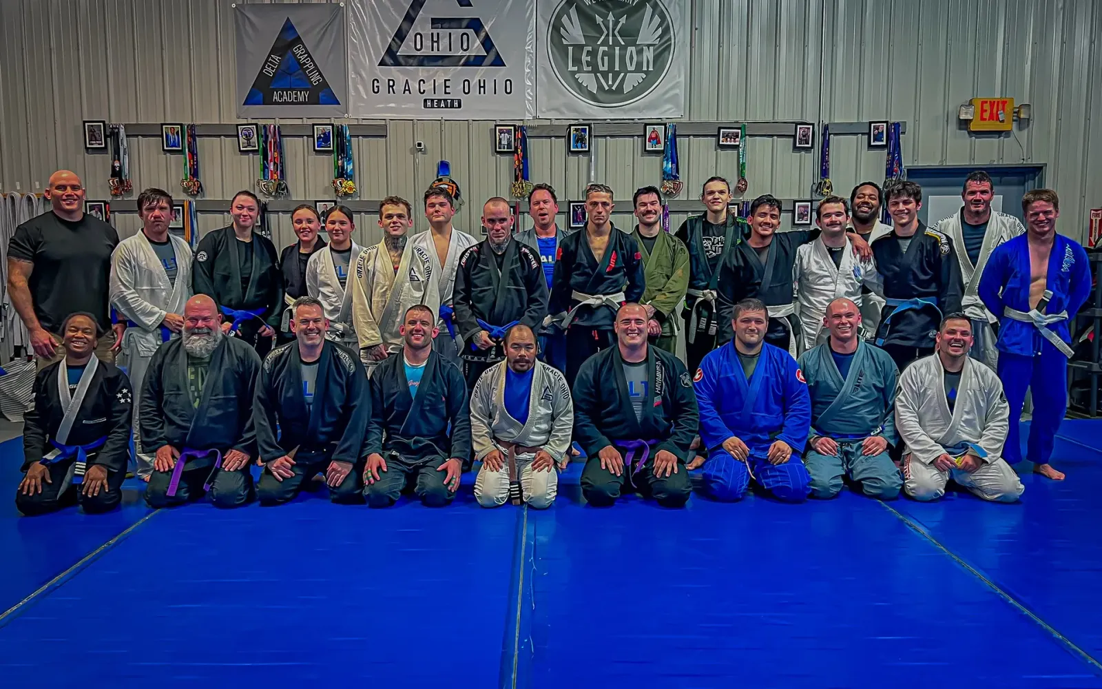 Delta jiu-jitsu team photo under the Gracie Ohio banner, worth the drive from Pataskala