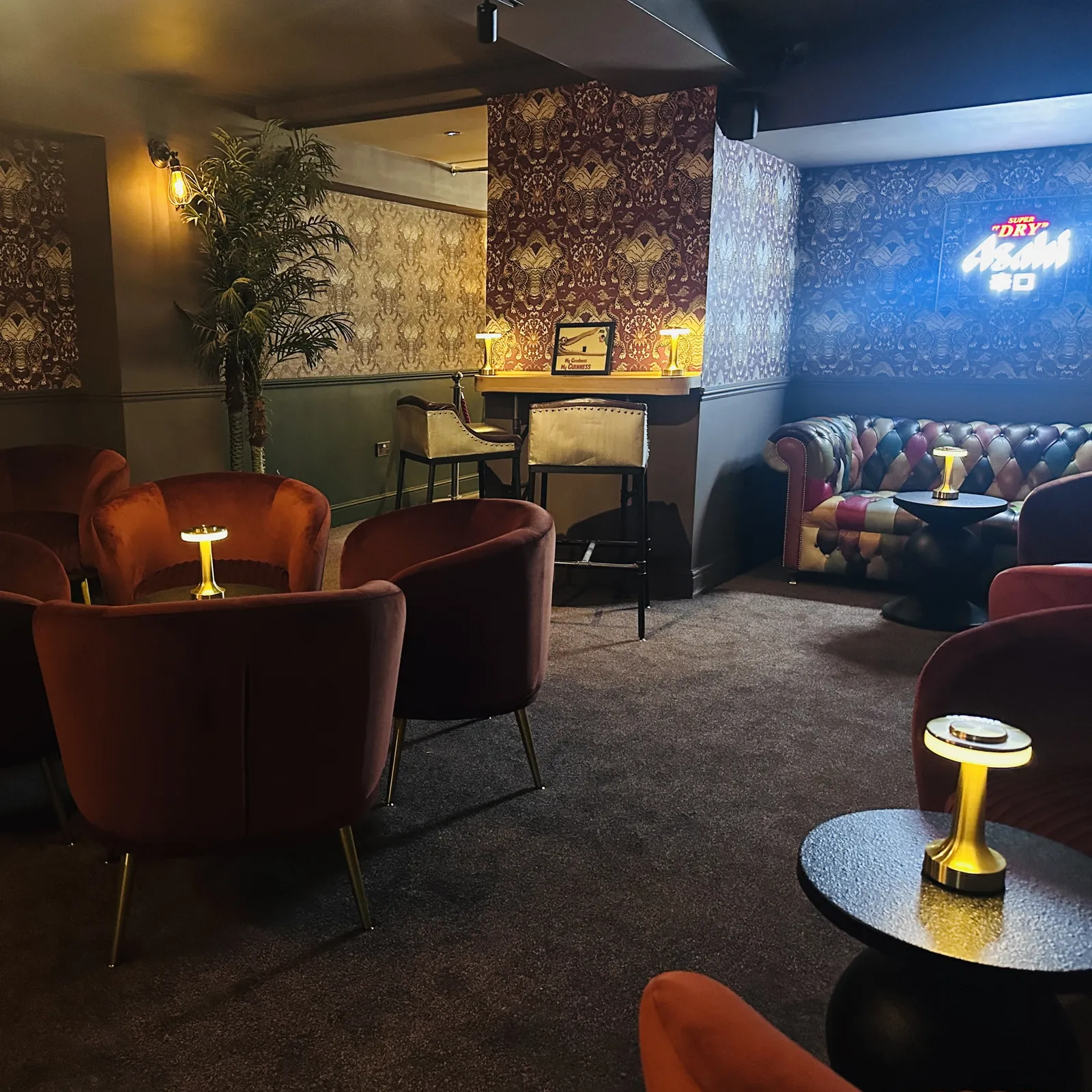 Velvet chairs and gold lamps in the Tiger Fusion cocktail lounge