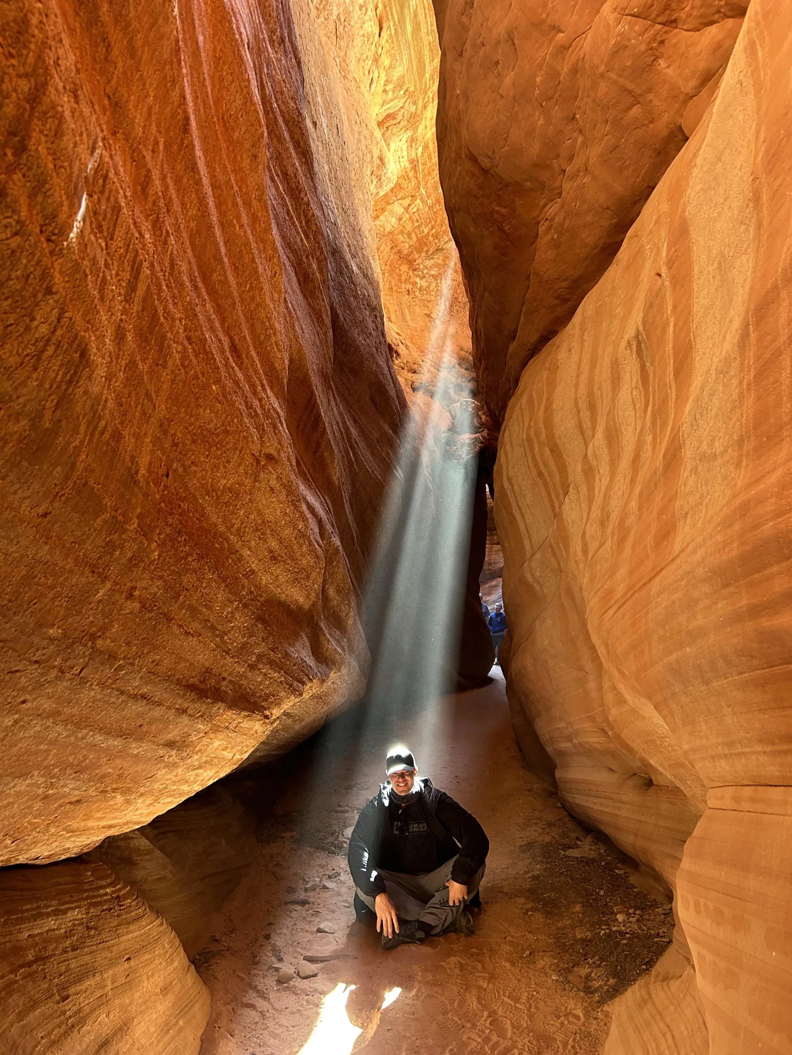 Sunbeams pouring into the narrow walls of Peek-A-Boo Slot Canyon near Kanab, Utah