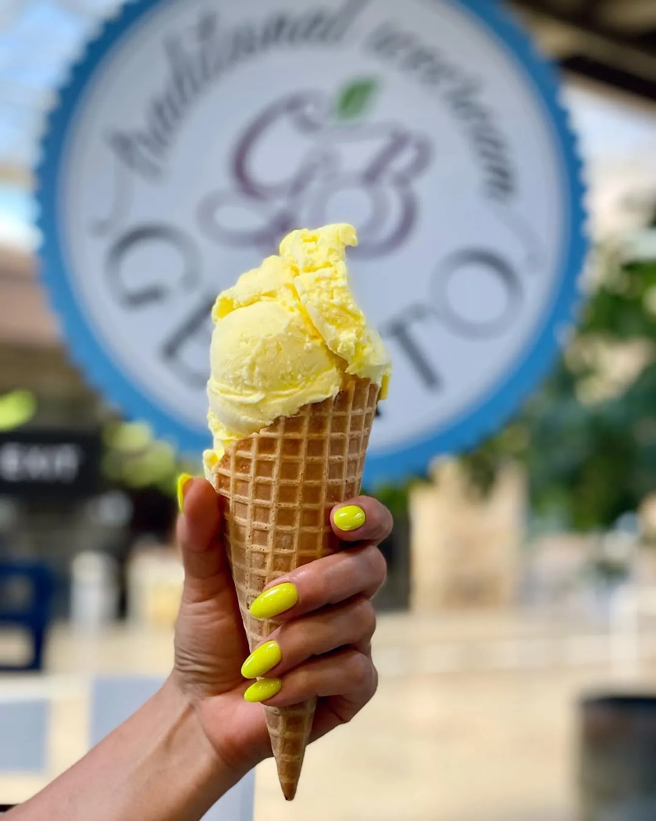 A cone in front of the GB Gelato logo