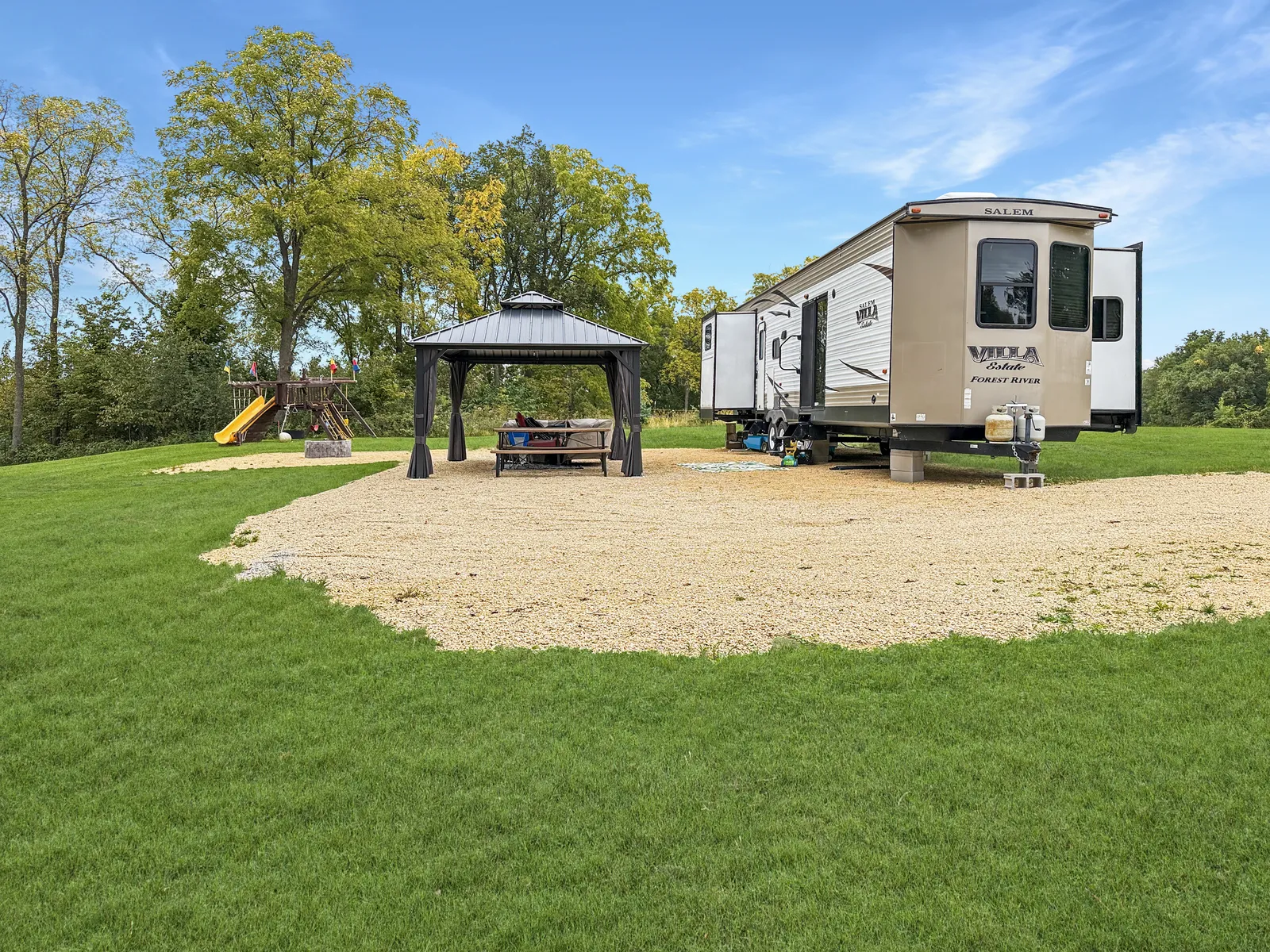 Camper, gazebo and playset at 5149 Shamrock Lane
