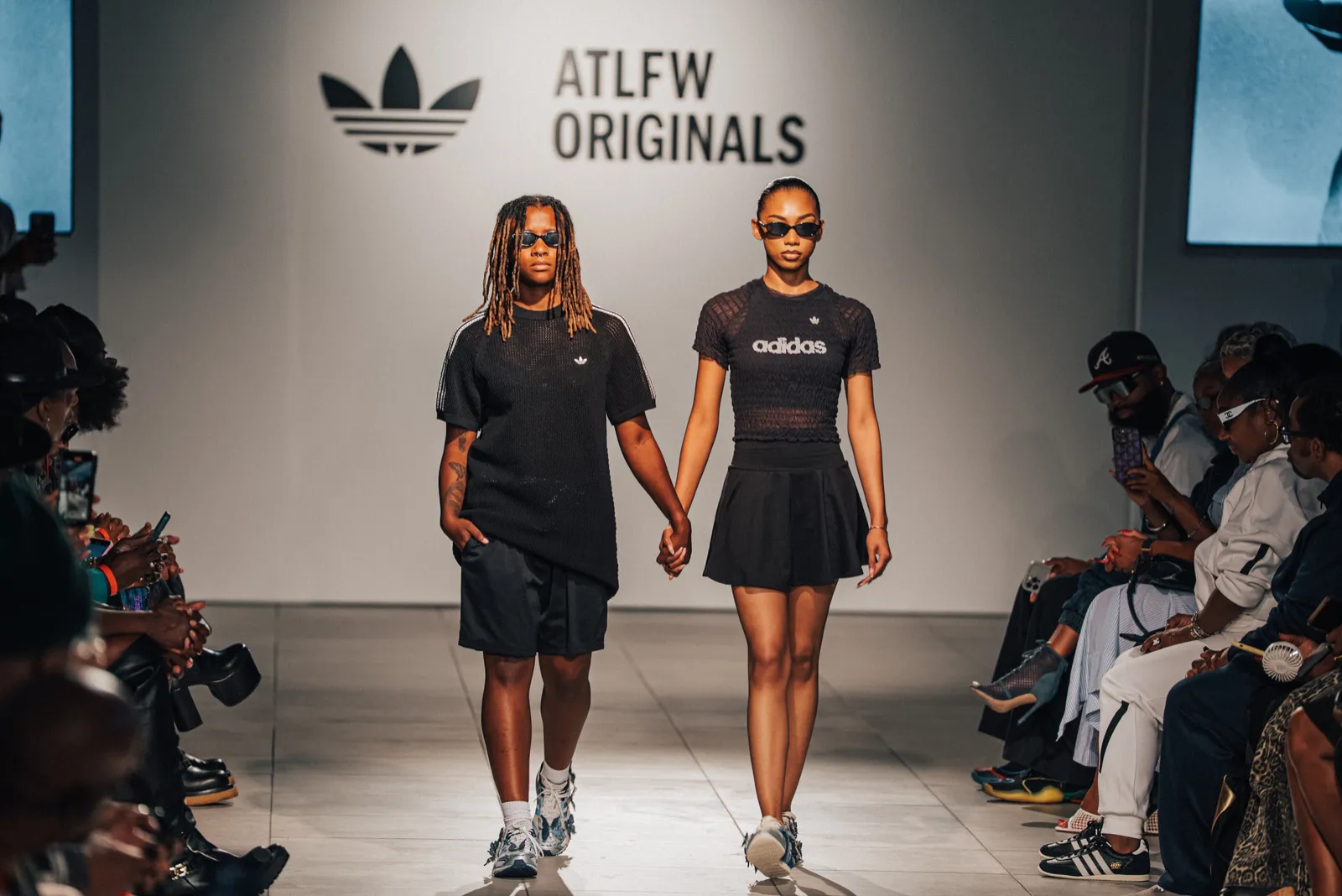 Two models closing the show on the runway