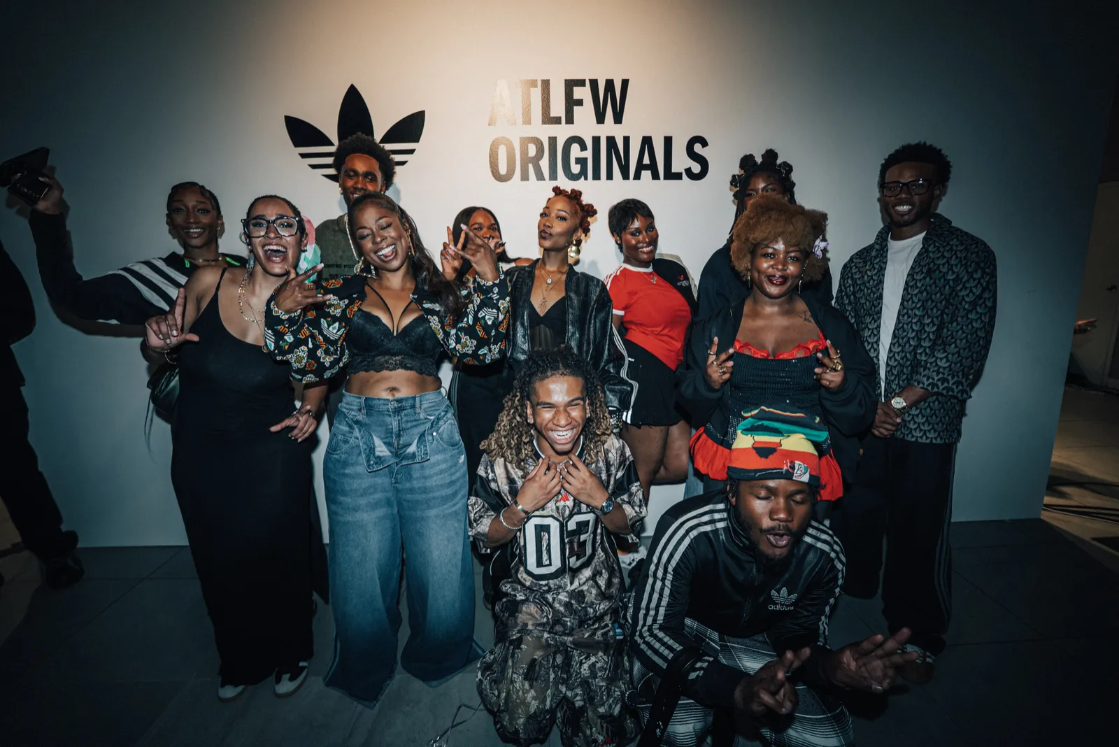 Designers and models together in front of the ATLFW Originals sign