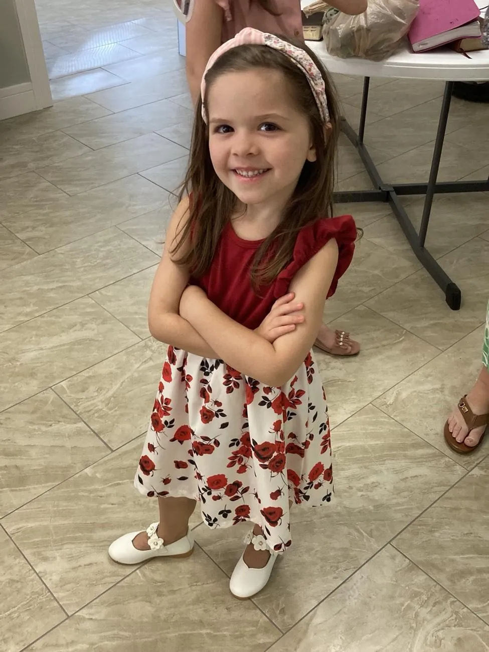 A little girl in the foyer, dressed for church