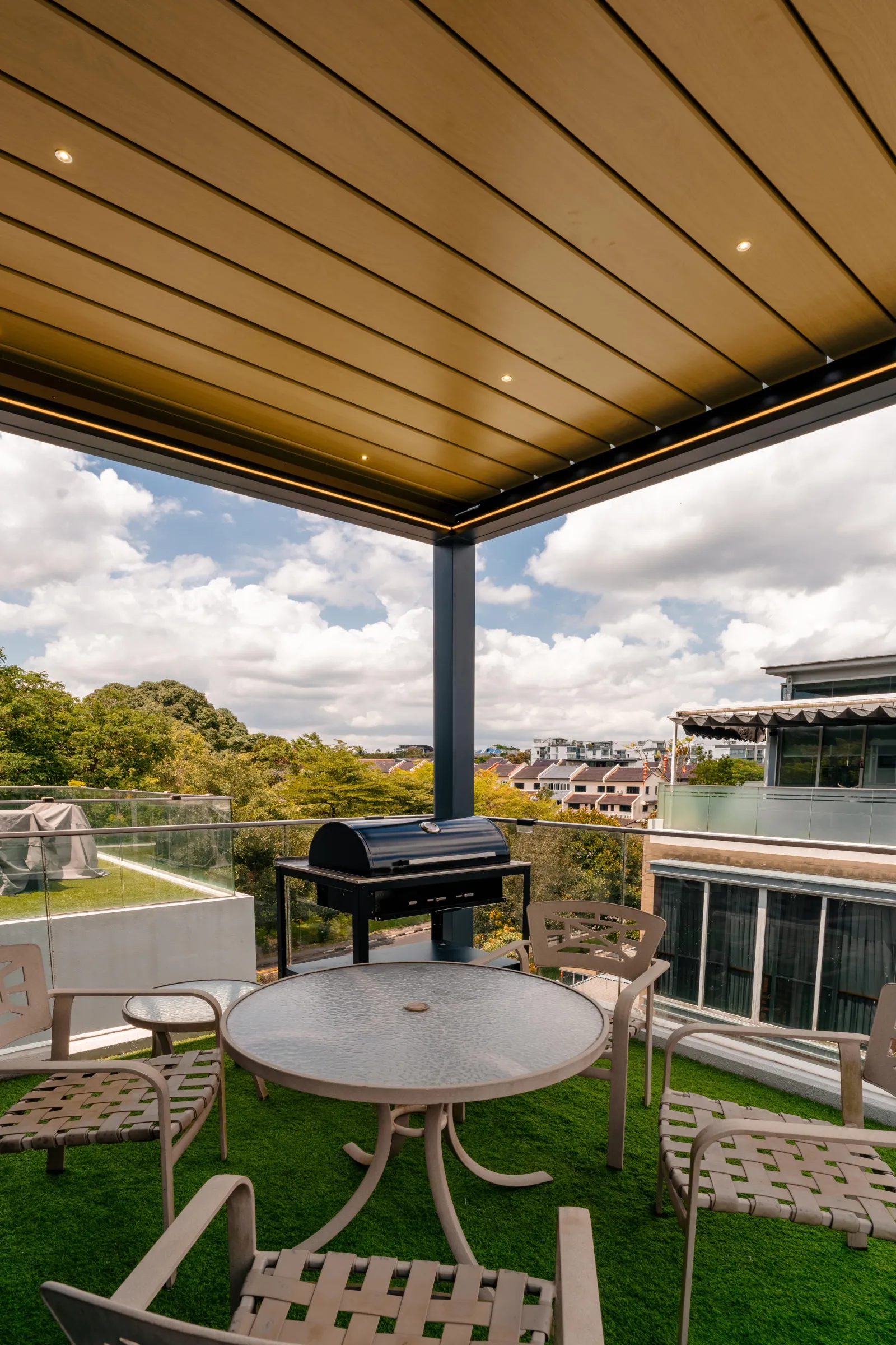 Timber-look ceiling over a rooftop barbecue terrace