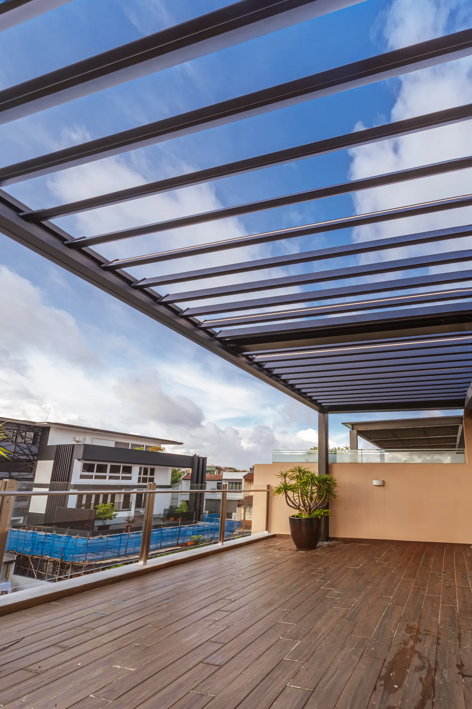Steel and glass roof extension over a terrace