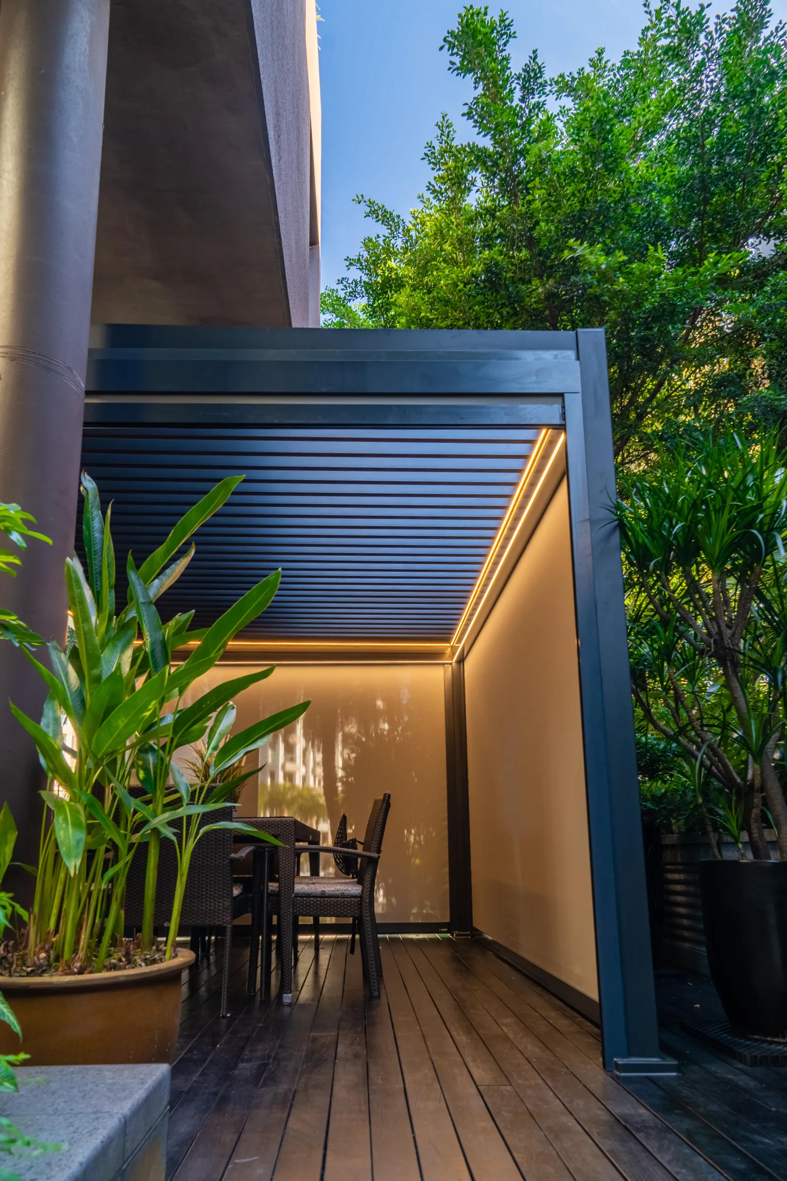 Covered entrance walkway with timber deck and planting