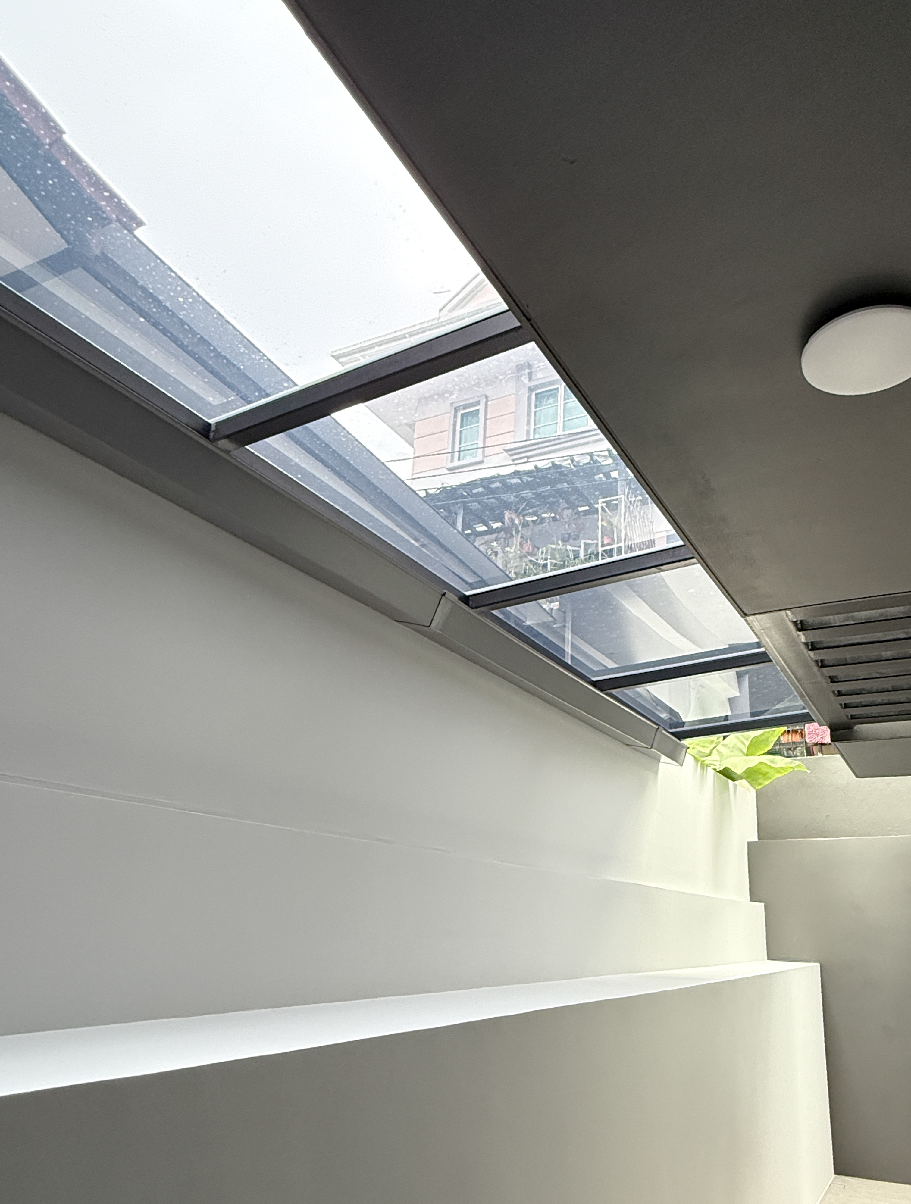 Glass skylight roof above a stairwell