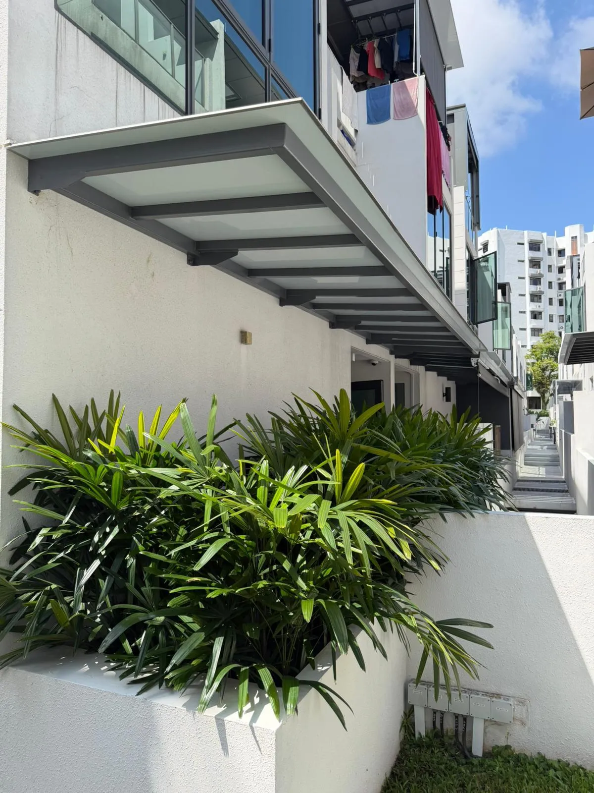 Aluminium composite canopy above a condo unit