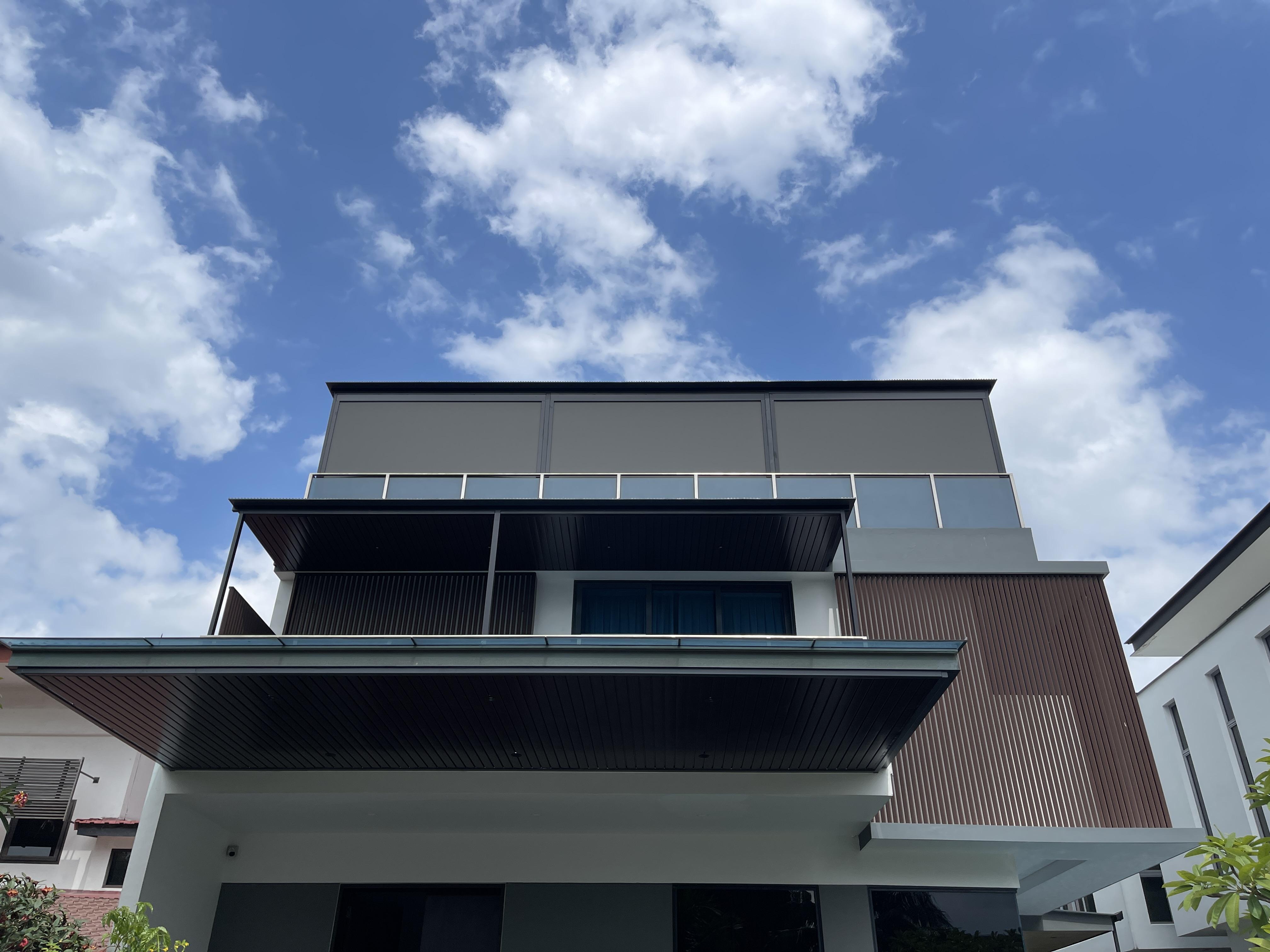 Roof extension on the front of a modern landed home