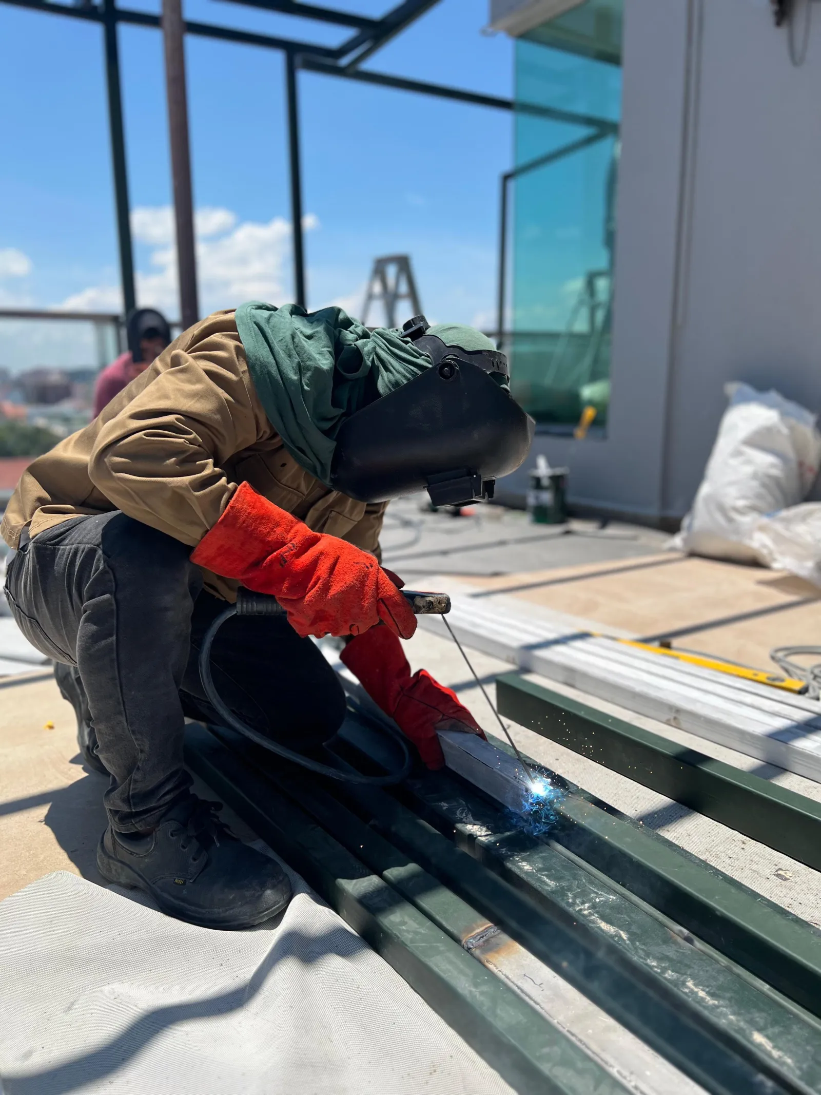 Installer laying composite decking boards