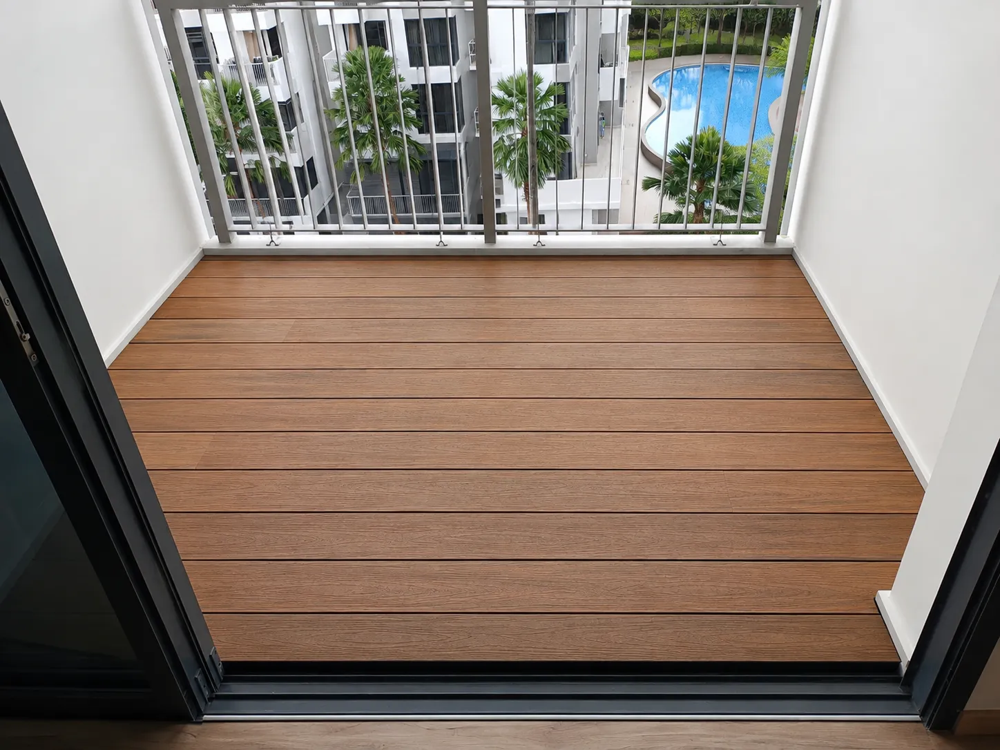 Composite decking on a balcony overlooking greenery