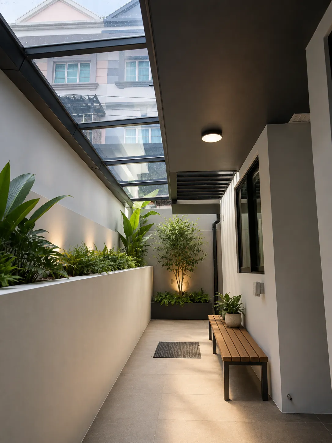 Polycarbonate roof over a side walkway between two houses