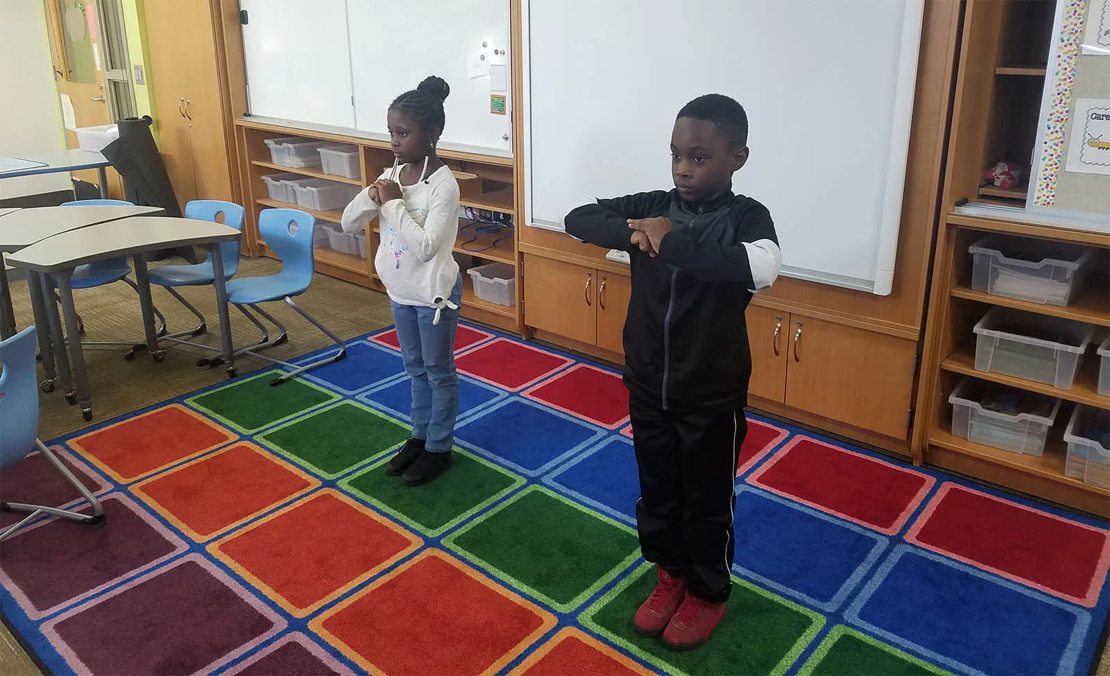 Kaizen Way students training together in the classroom dojo