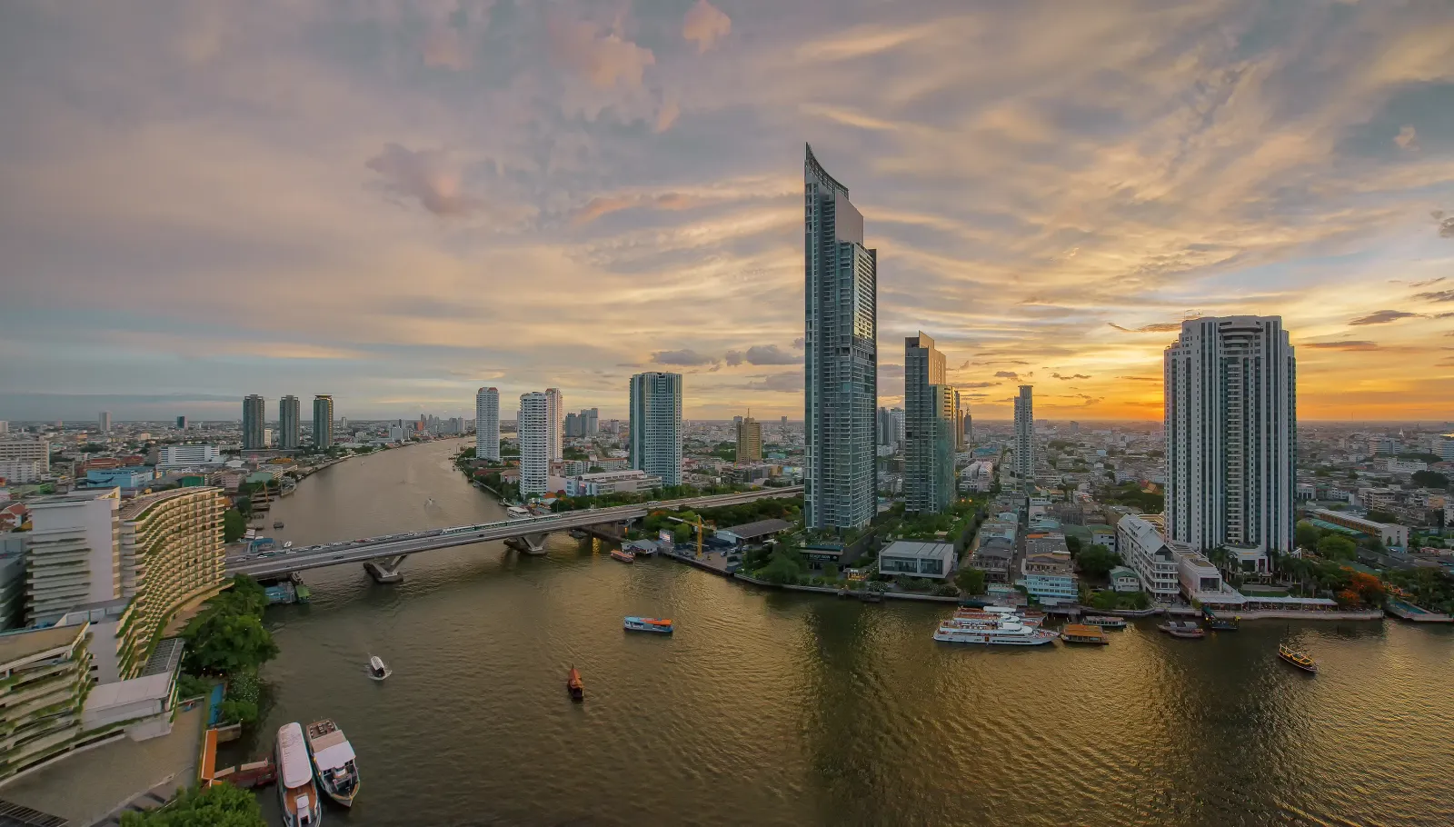 Bangkok skyline above the Chao Phraya River at sunset
