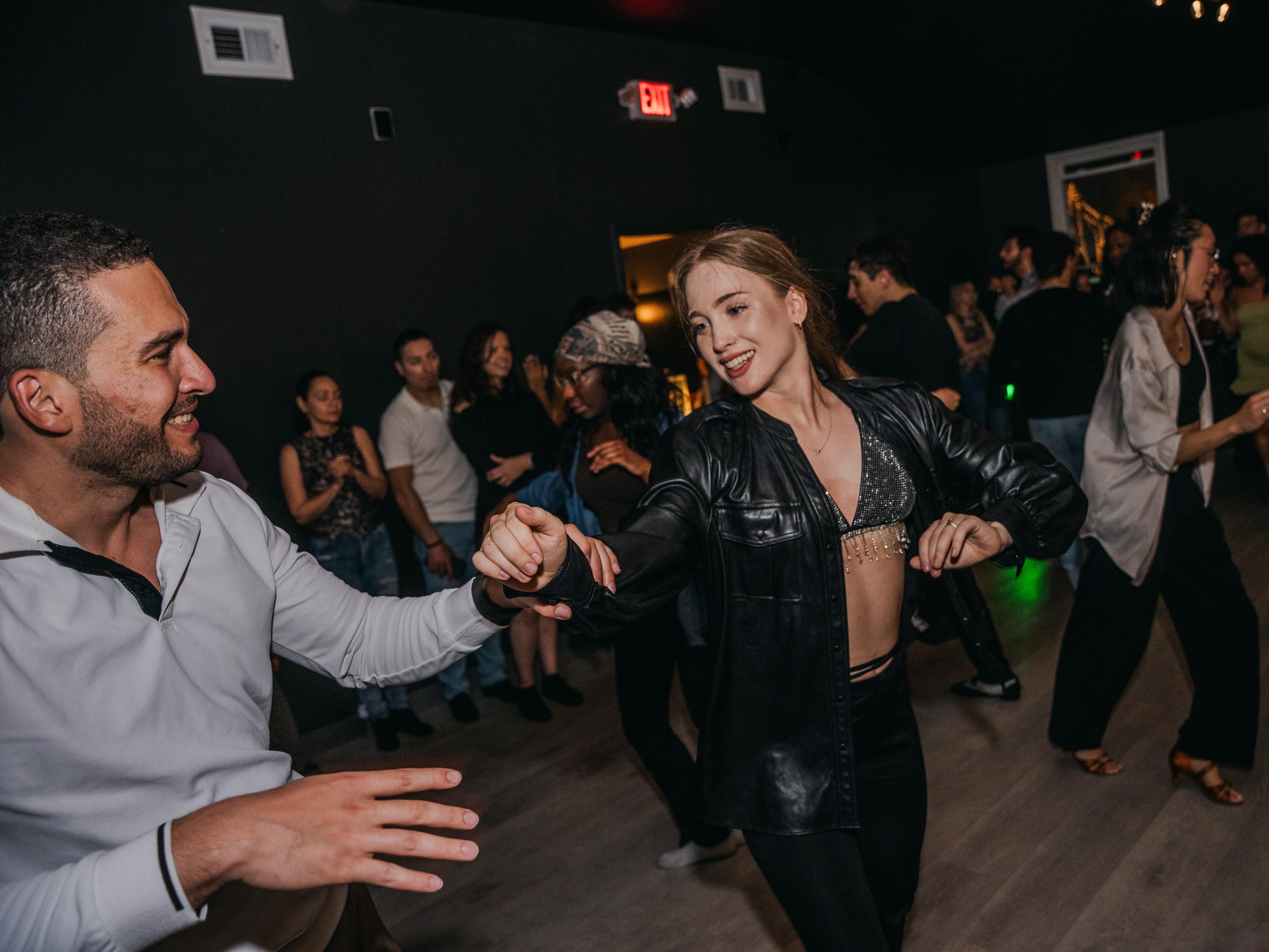 Couple dancing on a full floor