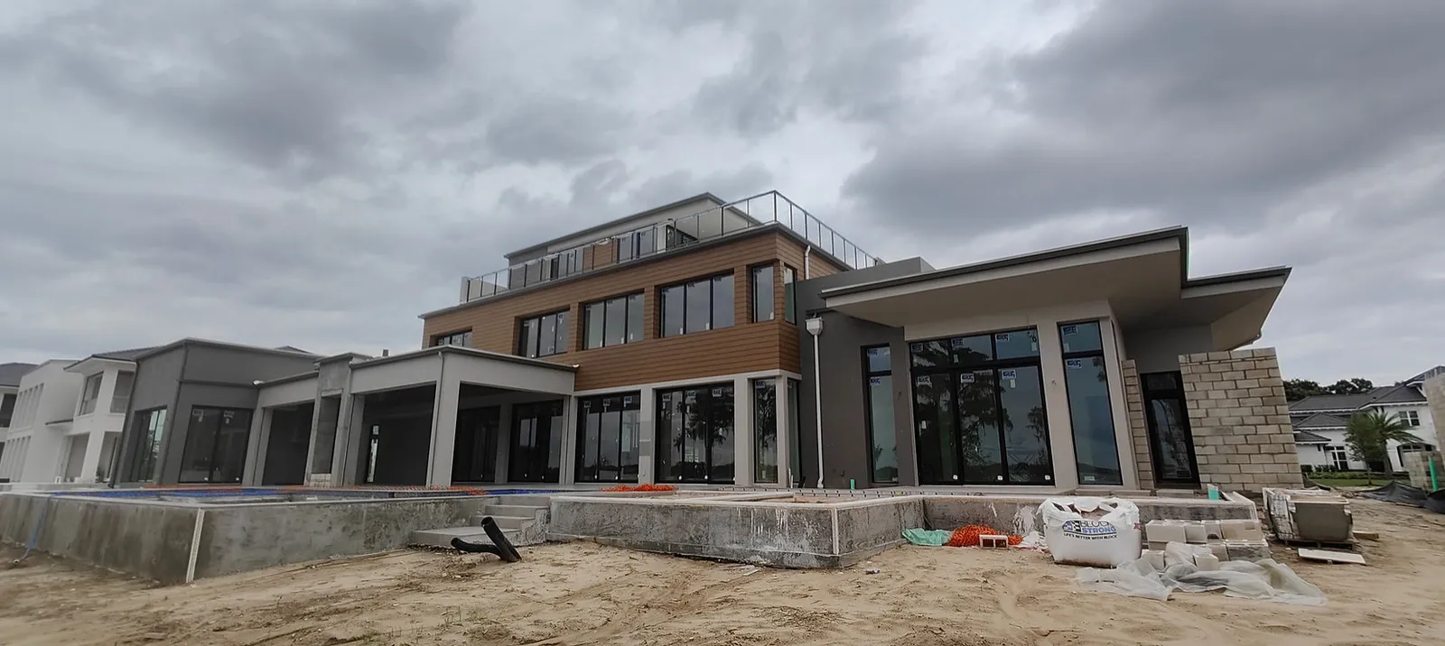 A modern Tampa Bay home with a freshly graded yard and pool protected by Trufam drainage