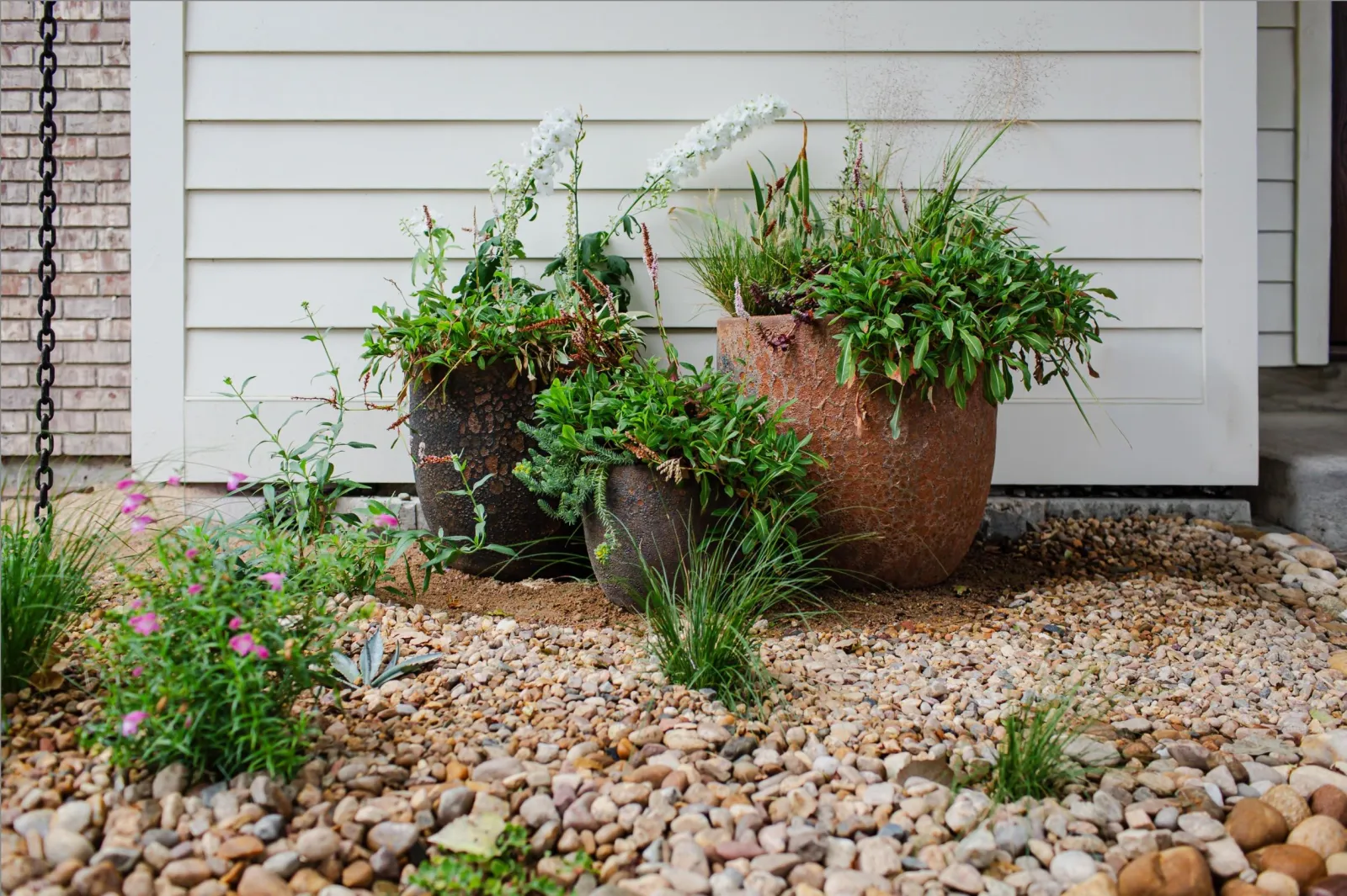 Planted pots and grasses sourced for a client garden