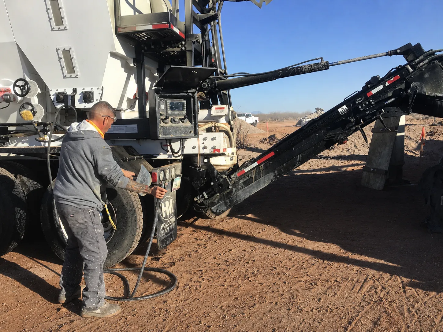 ProMix operator adjusting the mixer controls at the pour