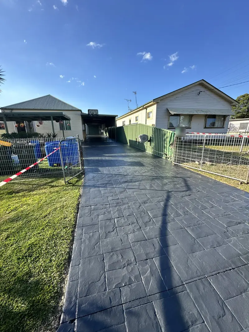 Stamped concrete driveway after colour sealing in the Illawarra