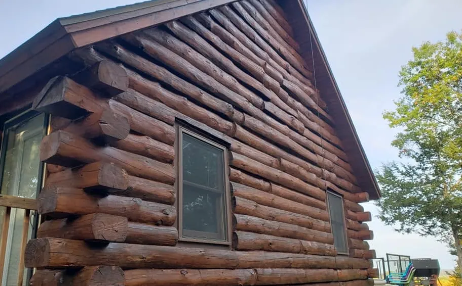 After: Log cabin with rich new stain and sealer
