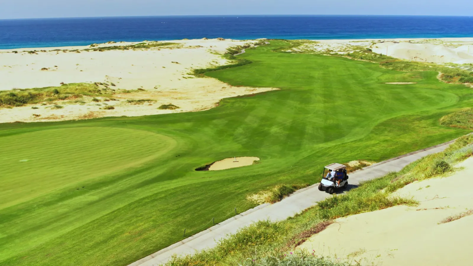 Solmar Golf Links fairway between sand dunes and the Pacific Ocean