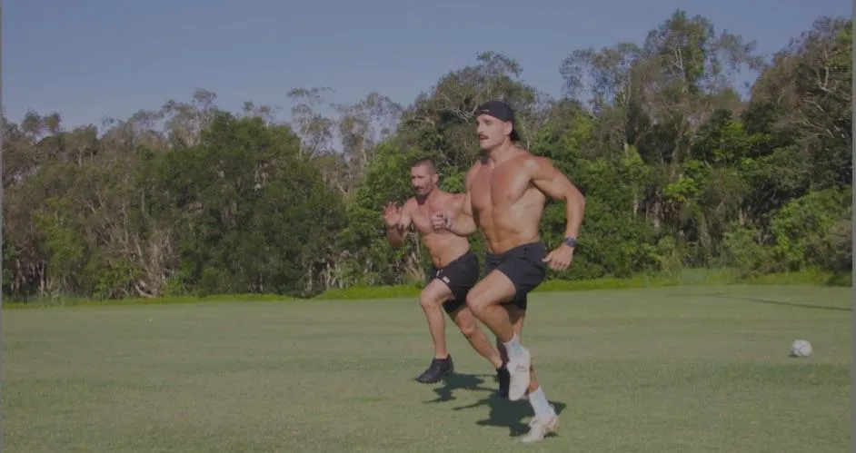 Rugby Development Coach athletes sprinting on field