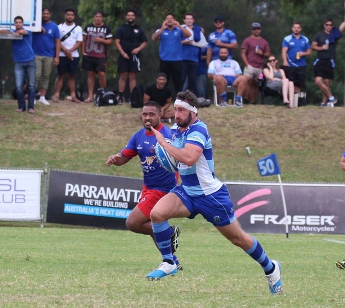 Rugby player in action during match