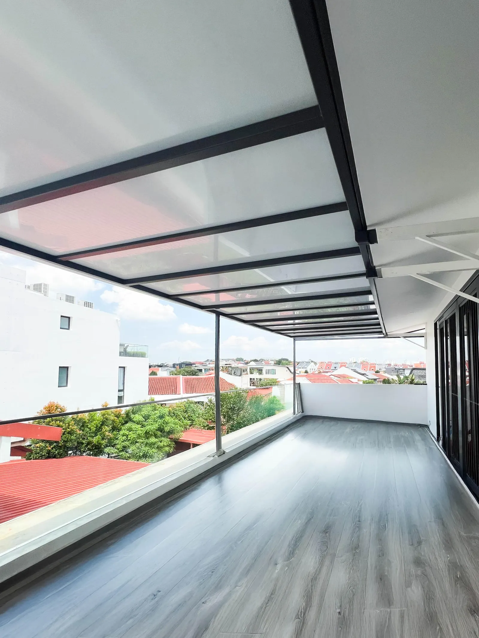 Polycarbonate terrace roof with a city view