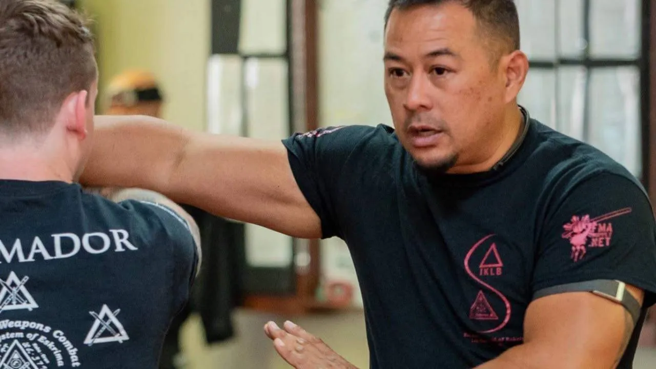 Inayan System of Eskrima instructor teaching a student