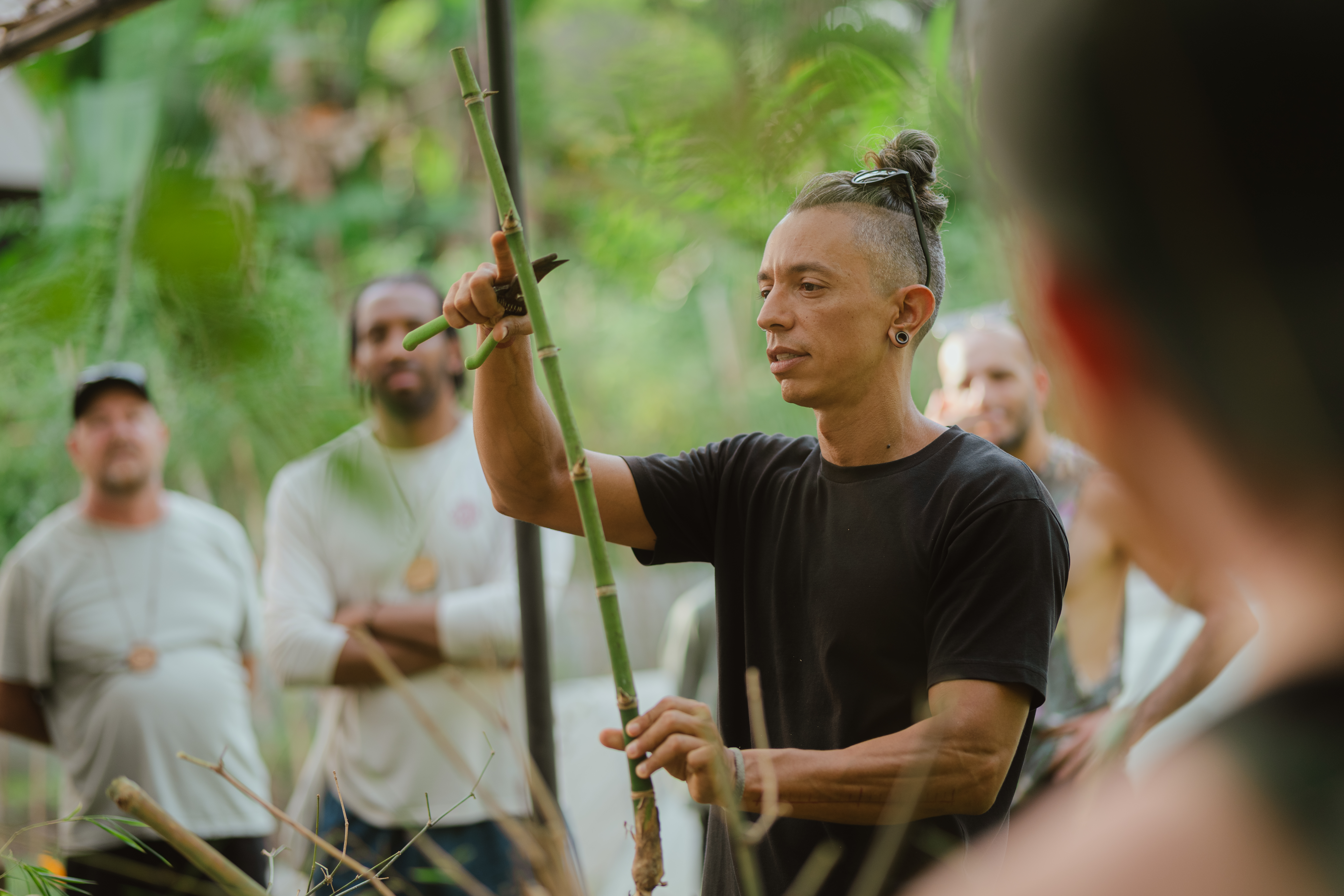 Bamboo expert teaching a group of students in the bamboo grove at Bamboo U in Bali