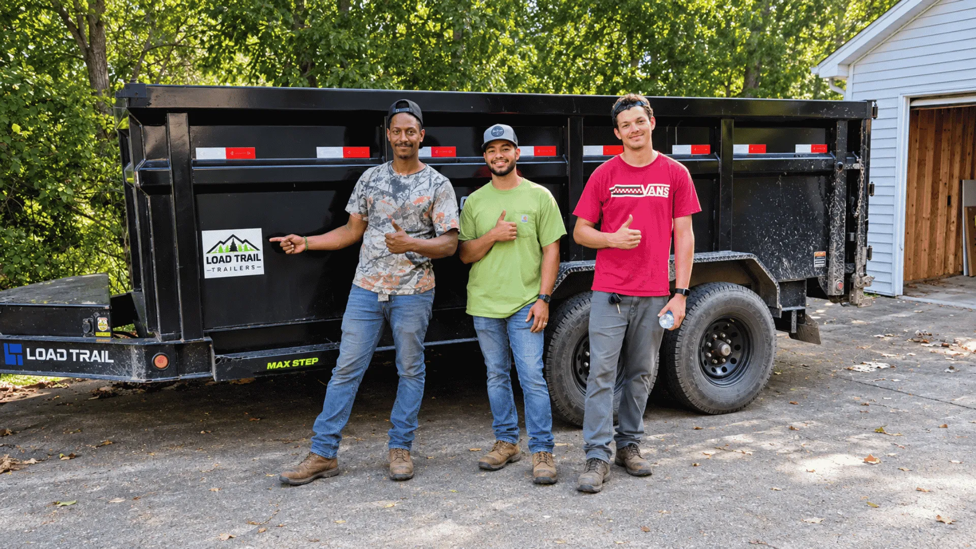 Next Level Junk Removal crew standing in front of their dump trailer
