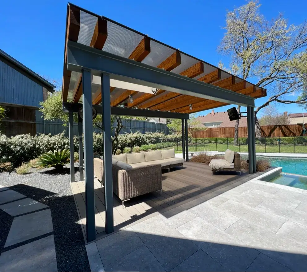 Modern steel and wood pergola over a pool patio with outdoor sofas