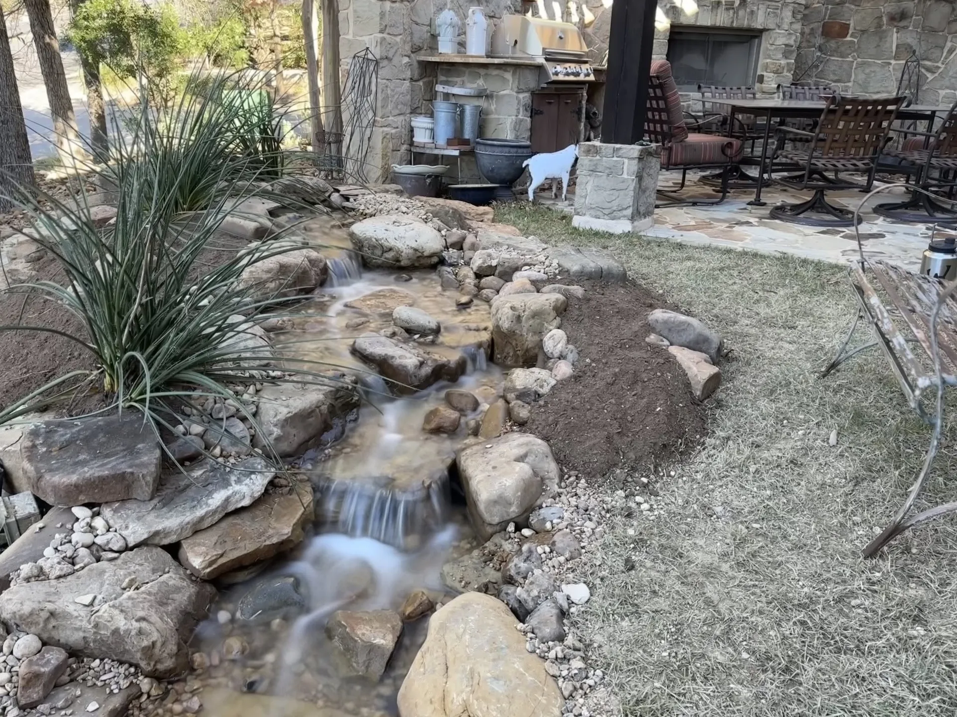 Pondless stream running beside a patio