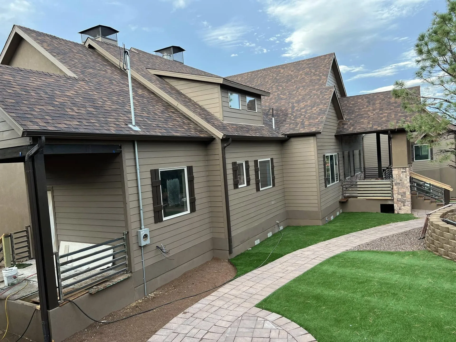Craftsman-style home with brown siding and dark trim