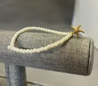 Bracelet- Pearl White Beads w/ Gold Starfish – Image 1