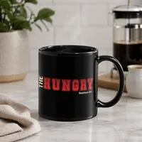 The Hungry Black Glossy Mug – Image 1