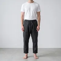 Pleated Paneled Linen Tapered Lounge Pants with Cuffed Hems in Jet Black – Image 1