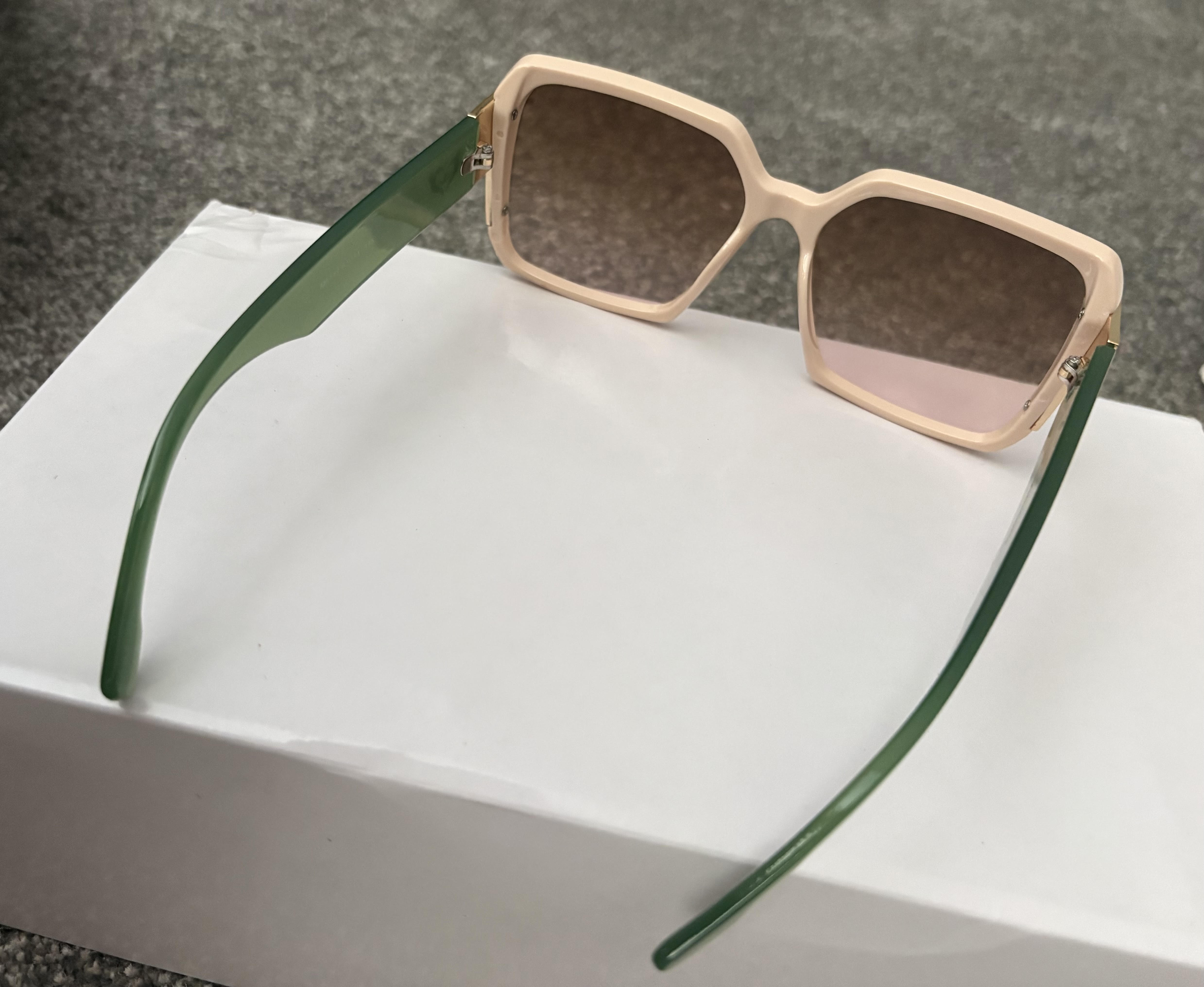 Sunglasses with Creme or light colored with green arms – Image 2