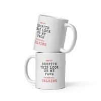 "And yet, despite this look on my face you are still talking" White glossy mug – Image 1