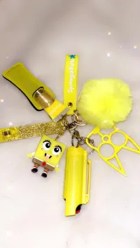 Happy Sponge Self-Defense Keychain | All Yellow Safety Keychain With Pom & Glitter Strap – Image 1