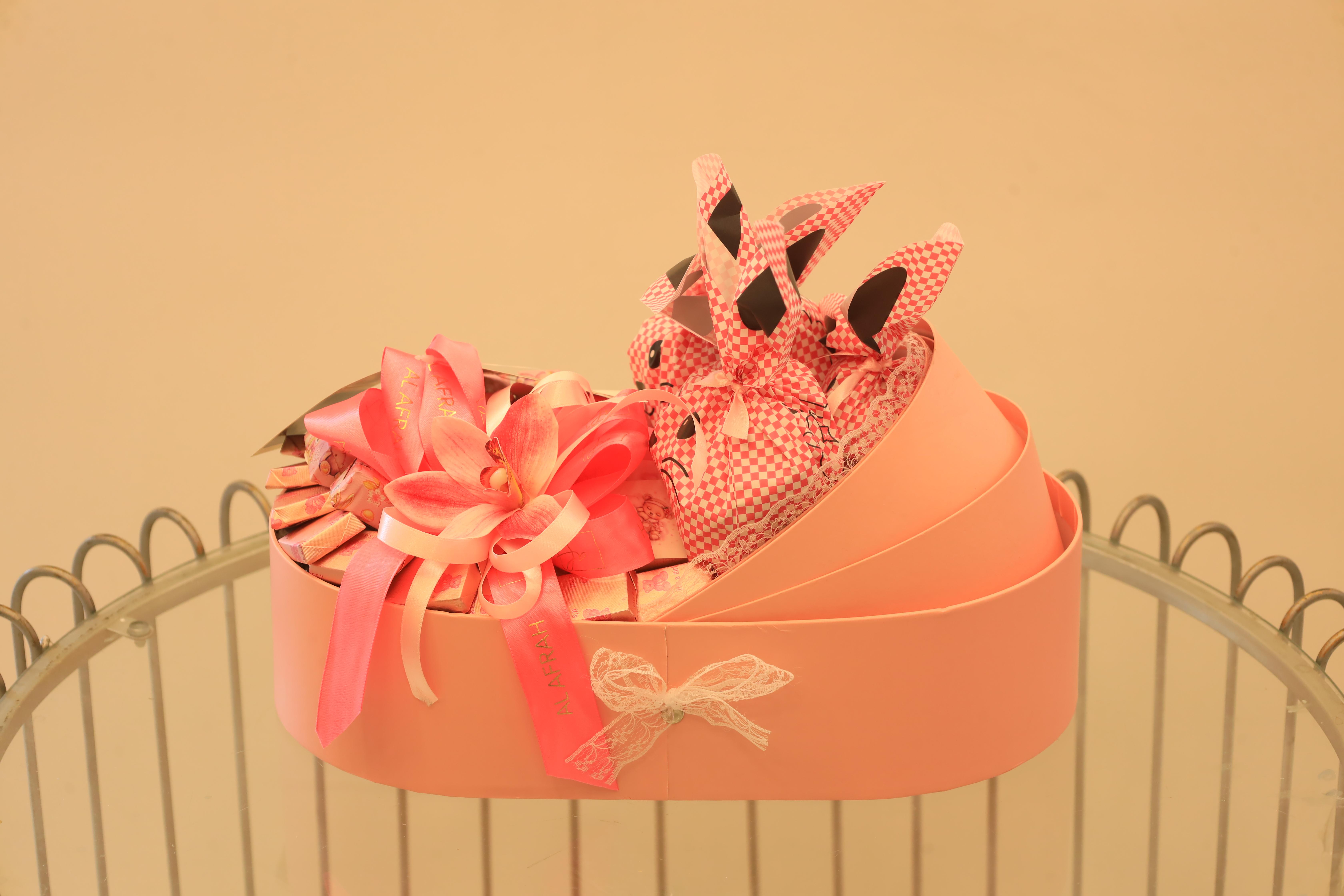 Pink Baby Girl Crib-Shaped Chocolate Gift Basket – Premium Sweets & Floral Decor – Image 1