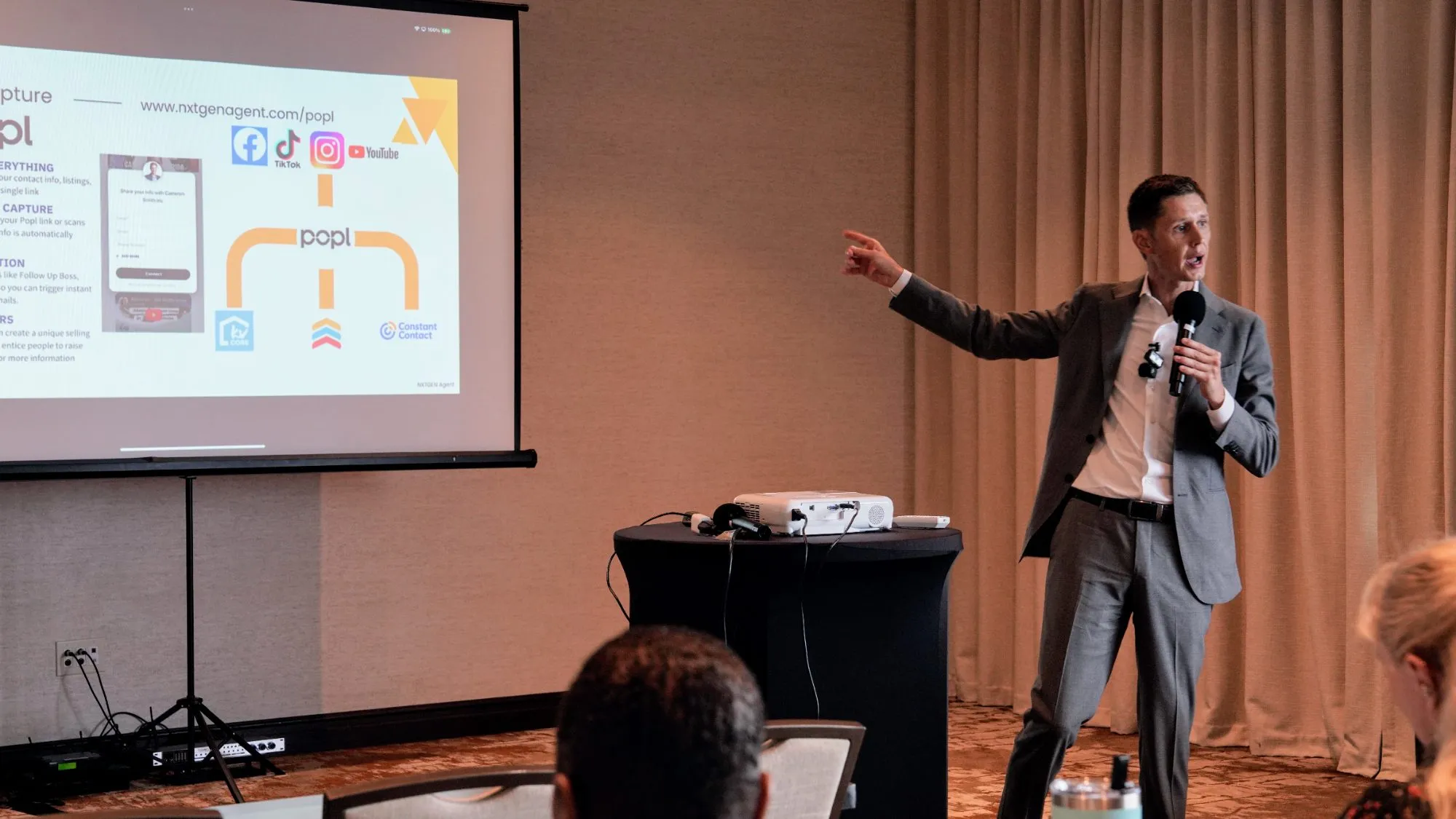 Cameron Smith presenting to a room of agents at a NXTGEN event