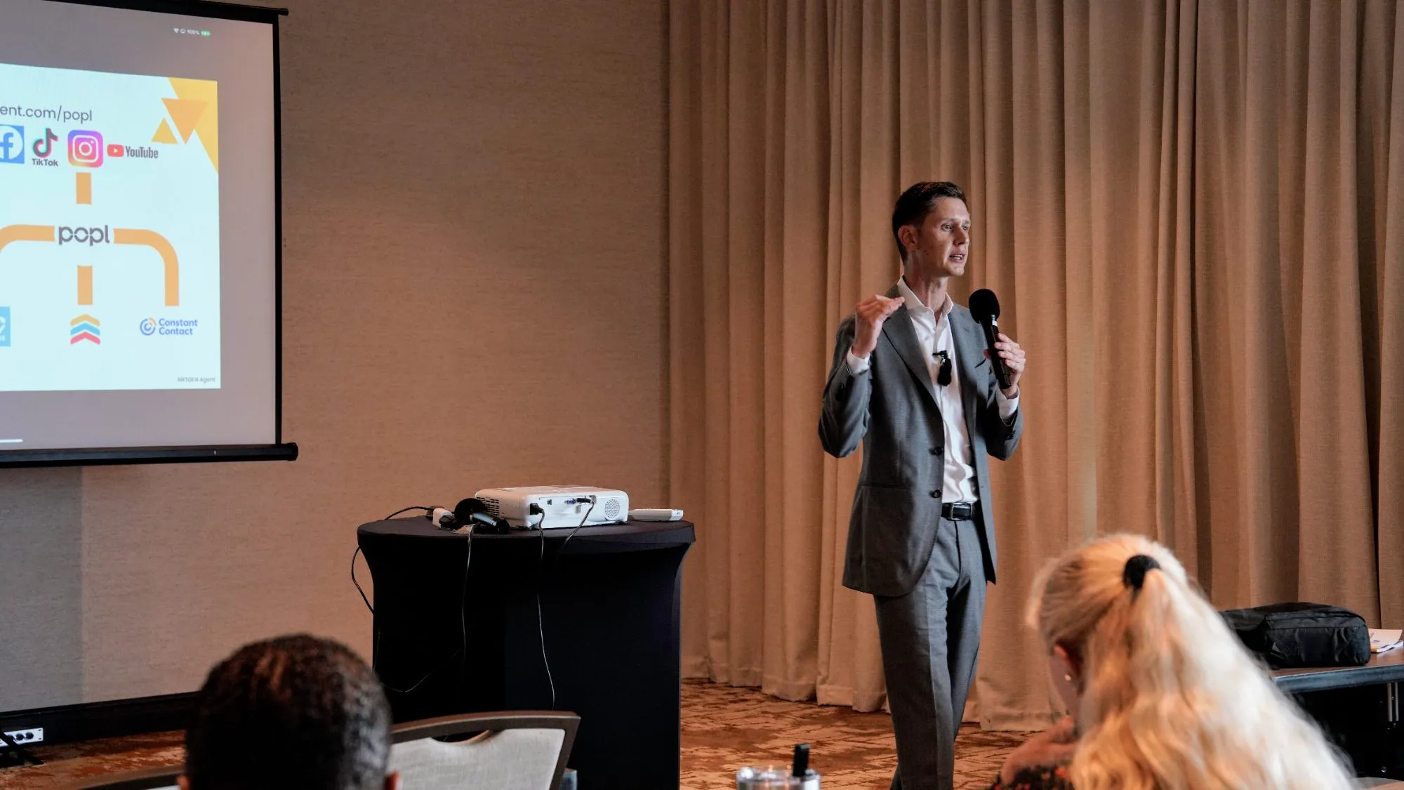 Cameron Smith speaking to agents at a NXTGEN event
