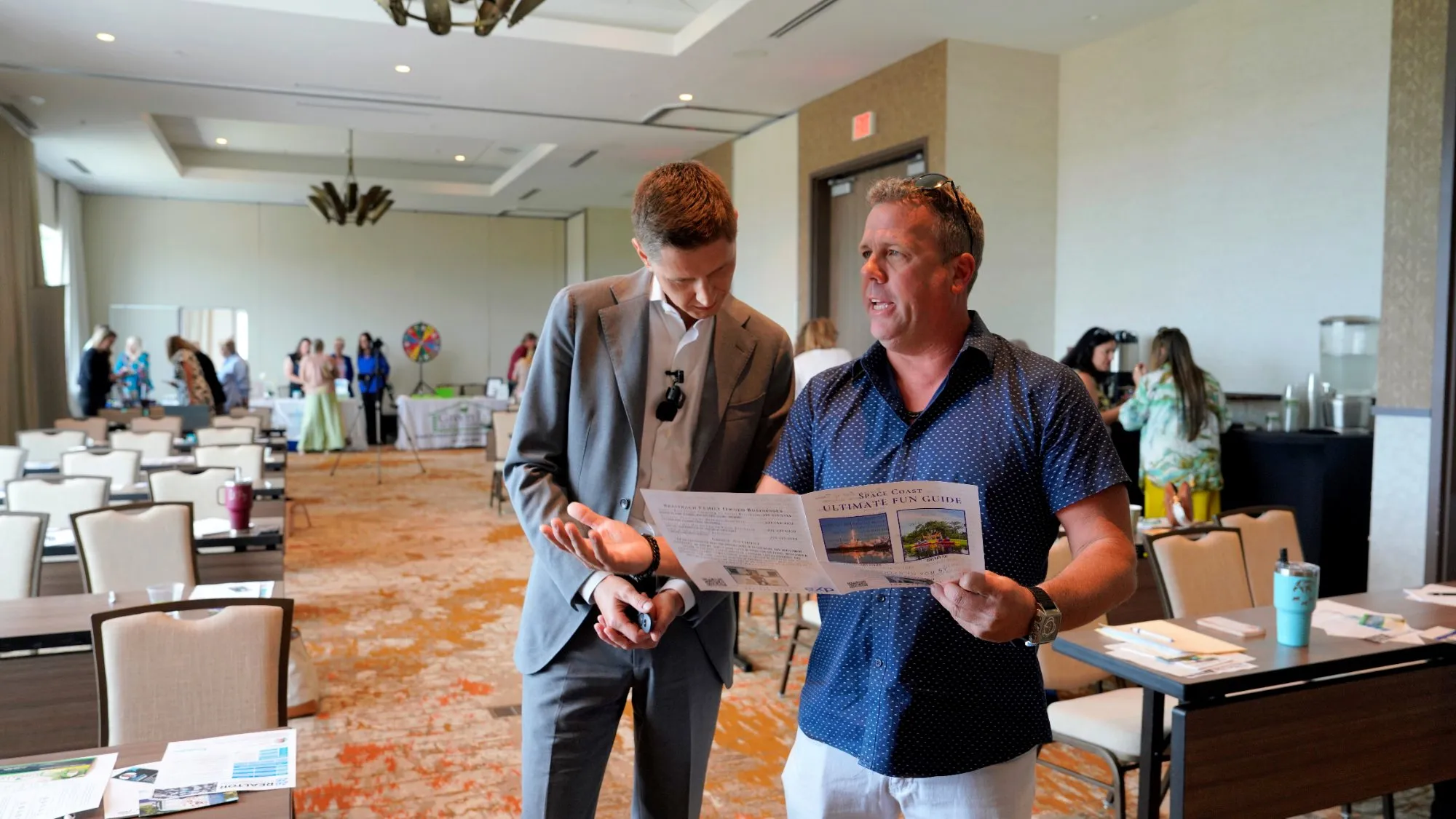 Cameron Smith going over a plan with an agent at a NXTGEN event