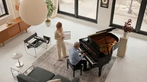 Stacey Bassetti teaching an adult student at the piano in her studio
