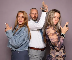 Group of friends posing playfully at an event