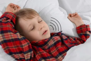 Your Child's Snoring Isn't Cute—It's a Red Flag (Here's What May Be Happening)