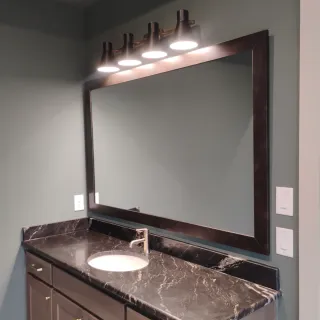 Framed vanity mirror install